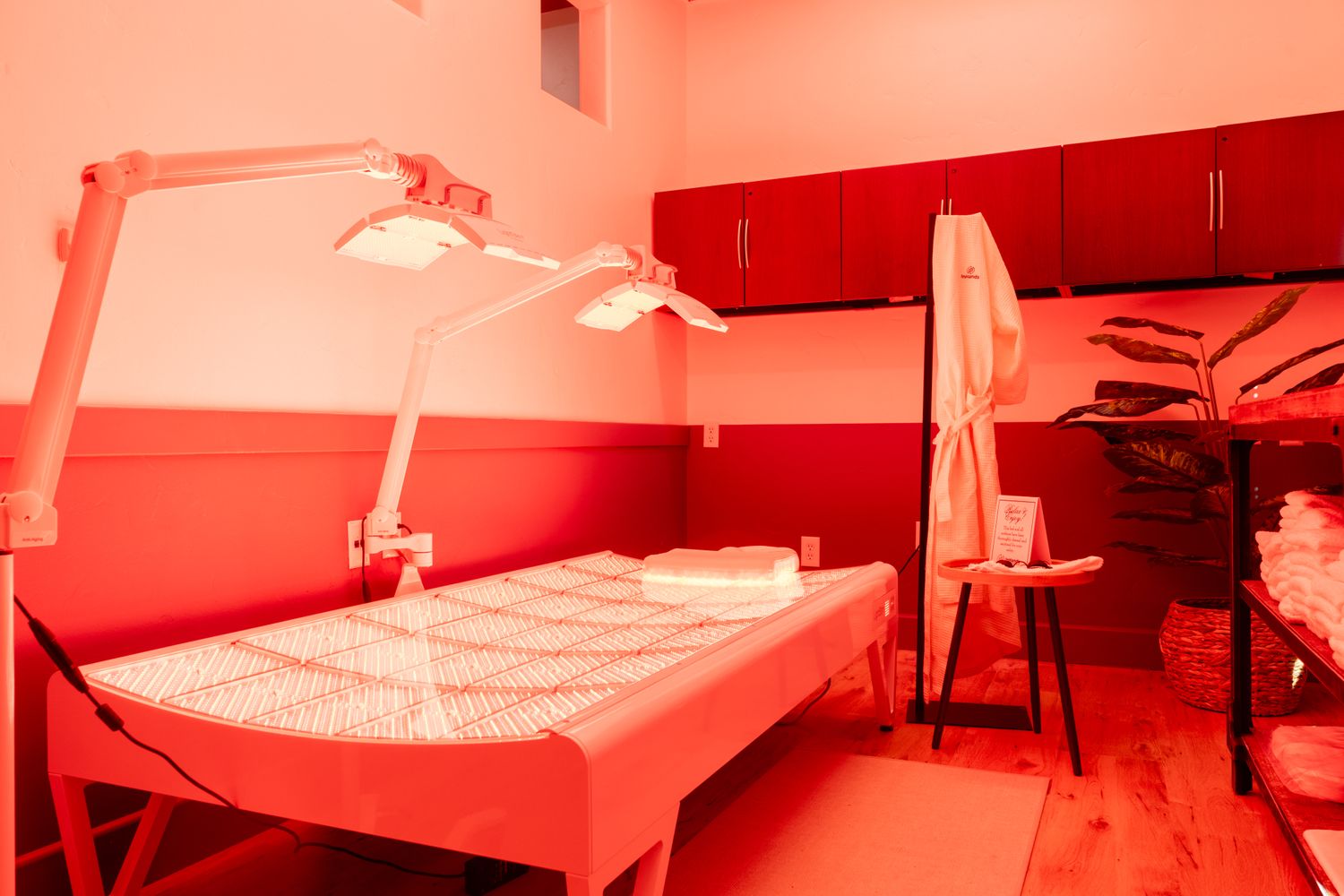 Smiling healthcare worker in scrubs.