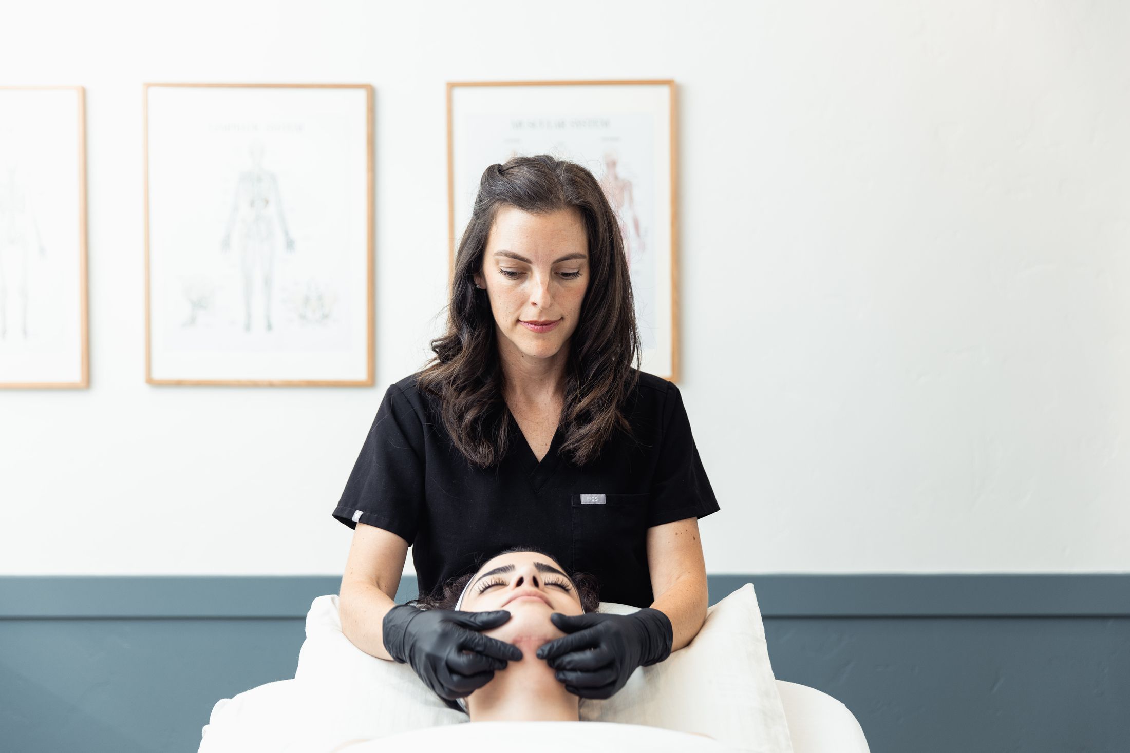Person receiving a relaxing facial massage treatment.